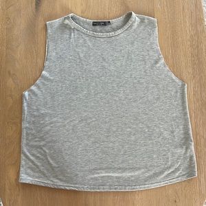 Gray, boxy, tank top. High neck and very comfy.